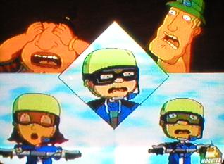 A 5-way split screen showing (from top to bottom and left to right) surf shop worker Tito (Ray Bumatai), owner of said surf shop Ray (John Kassir), nerd Sammy (Gary LeRoi Gray, previously, Sam Suletta), Ray's daughter Reggie (Shayna Fox), and her younger brother Otto's (Joseph Ashton) best friend Twister (Ulysses Cuadra), with the last 3 competing in a team race (thus the uniforms and helmets)... apologies for the substandard picture quality